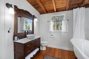 Bathtub, hair dryer, towels, soap
