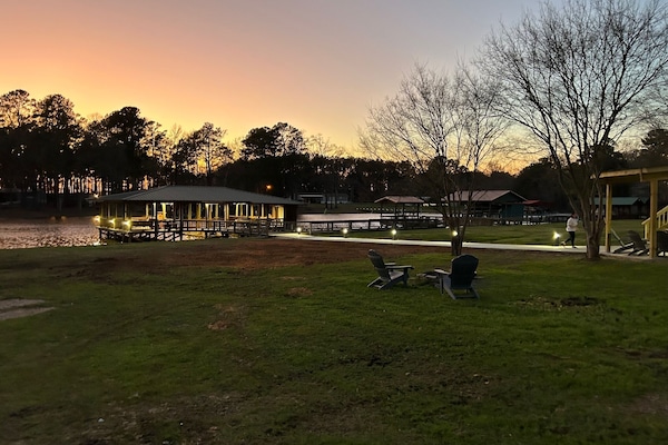 Large yard, fire pit, huge boathouse, and stunning sunsets