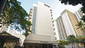 A hotel named "The Seashore" with a modern facade, large windows, and a visible address number "2450". - Sea Shore 41 Private Studio in Waikiki, 1 Block to Beach (Honolulu)
