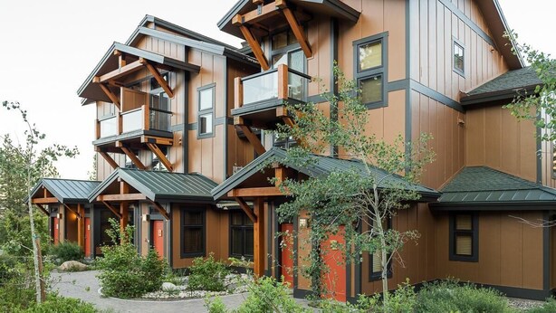 A multi-story building with a modern architectural design, featuring balconies and large windows. - Solstice 21 | Easy Walk to Eagle Lodge (mammoth lakes)