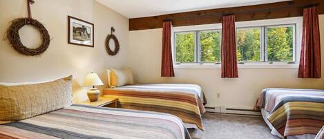 Three-Twin Bedroom - Perfect for families and groups, this spacious bedroom offers three twin beds and plenty of room for everyone to relax after a day on the slopes.