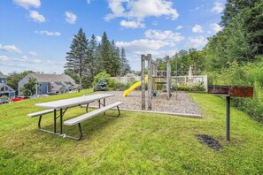 Enjoy dining or relaxing at this outdoor space with a picnic table and playground for kids.