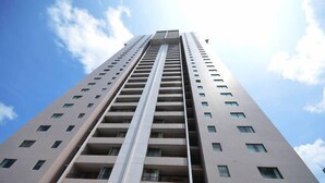 A tall, modern high-rise building with multiple floors and balconies. - Royal Kuhio 1309 with King Bed, FREE Parking/WiFi, mins to BEACH! (Honolulu)