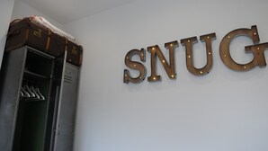 A wall with the word "SNUG" in large, illuminated letters. - 'The Snug' nr York: stunning self-contained studio @ Old Station Master's House. (Riccall)