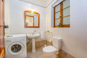 Bathtub, hair dryer, towels