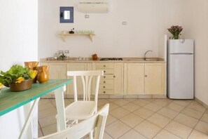 Fridge, stovetop, cookware/dishes/utensils