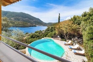 An infinity pool, pool loungers