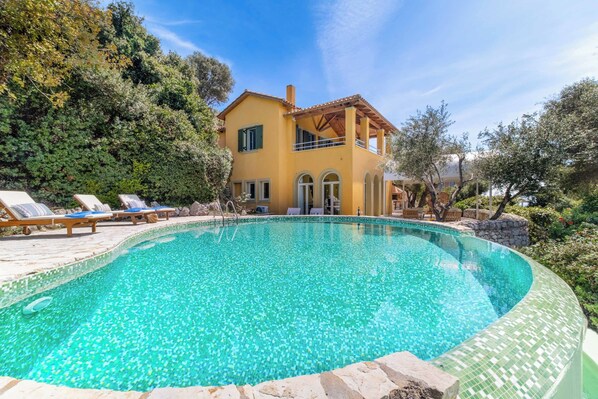 An infinity pool, pool loungers
