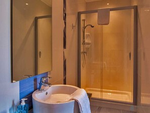Bathtub, hair dryer, towels