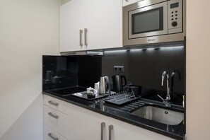 Fridge, microwave, toaster, cookware/dishes/utensils