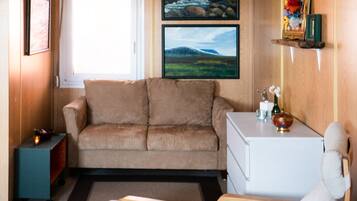 Studio Apartment (2 adults) | Living area | Flat-screen TV