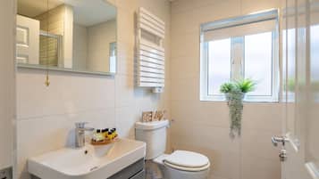 Bathtub, hair dryer, towels