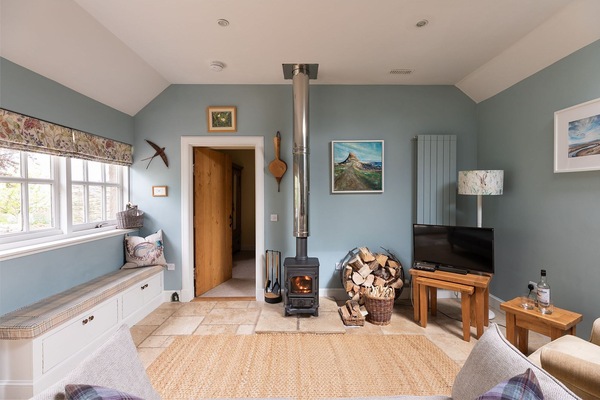 The Heritage - open plan sitting room with multi-fuel stove