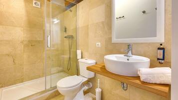 Shower, hair dryer, towels, toilet paper