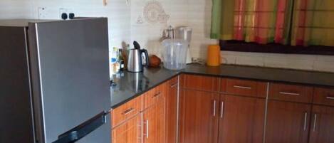 Comfort Apartment | Private kitchen | Full-size fridge, microwave, oven, stovetop