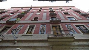 A multi-story building with balconies, windows, and decorative elements. - Art 3 - Habitat Apartments (Barcelona)