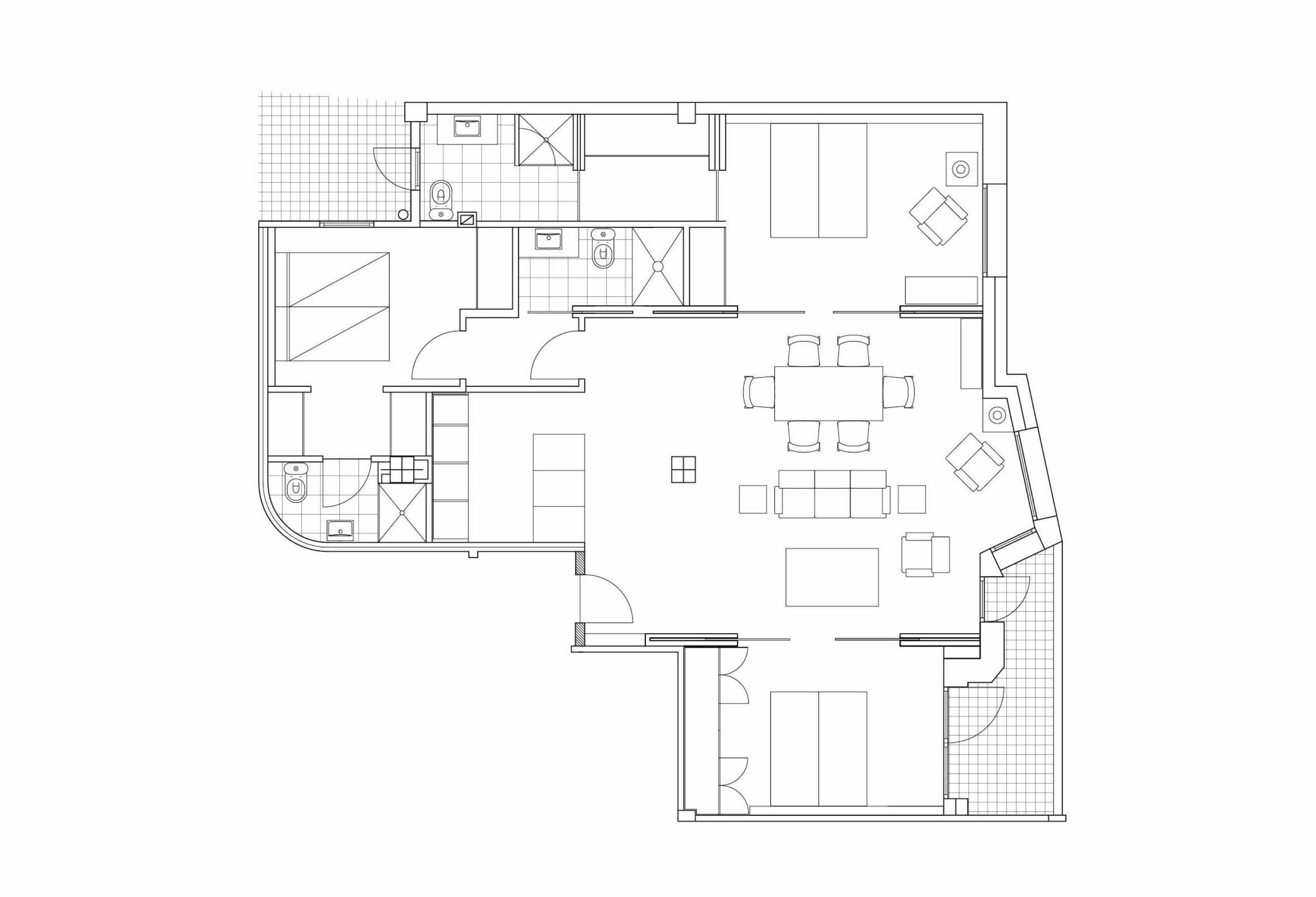 Un plan d’étage d’un hôtel comprenant une cuisine, un coin repas et plusieurs chambres.