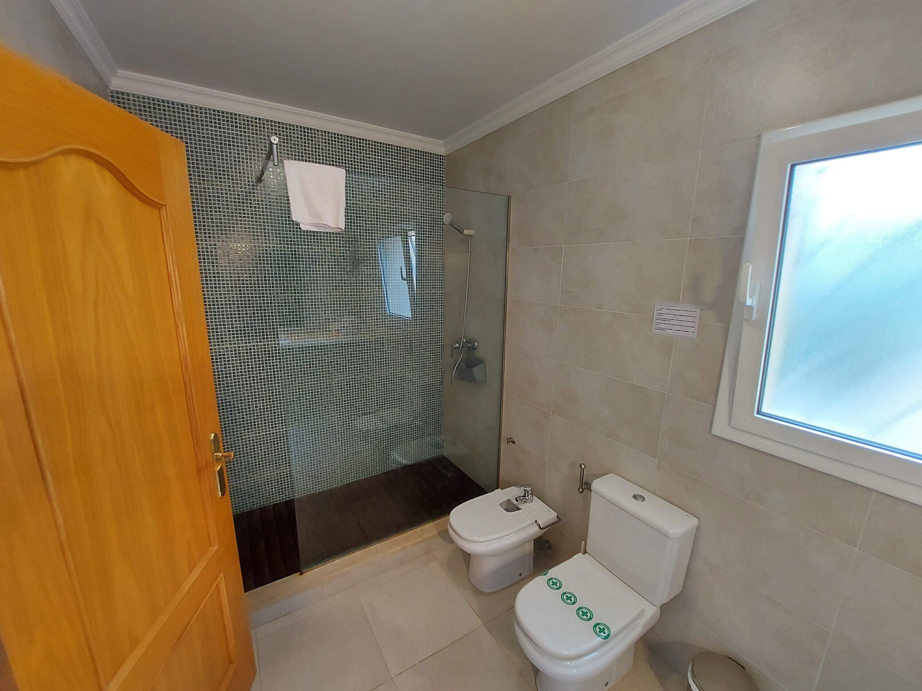 Shower, towels, toilet paper