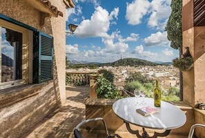 Enjoy a romantic dinner for two on this charming outdoor space with a scenic view of the town.