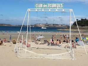 Relax by the beach at CLUB des ÉCUREUILS, where guests can swim, sunbathe, and play volleyball.