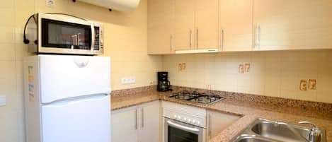 Fridge, oven, coffee/tea maker, toaster