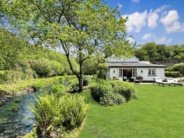 A house with a garden, a pond, and a clear sky. - The Folly, Bratton Fleming (Barnstaple)