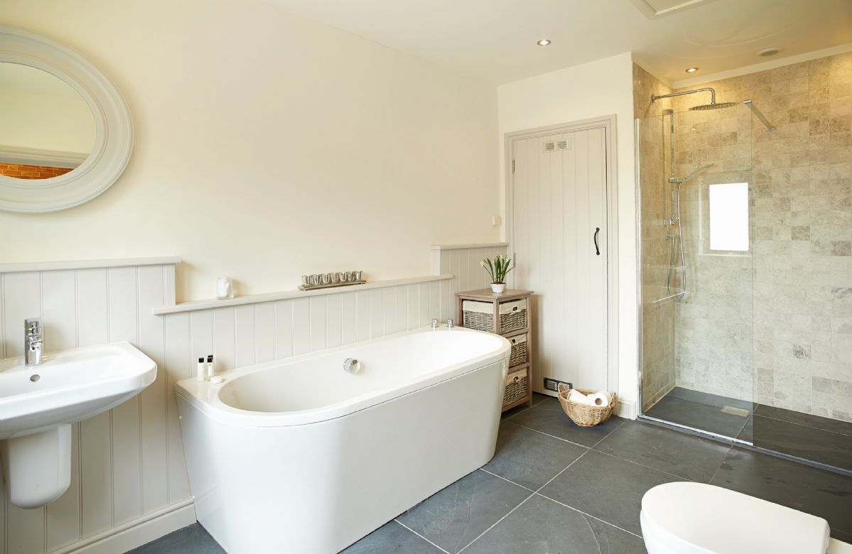 Ground floor: En-suite bathroom with separate shower