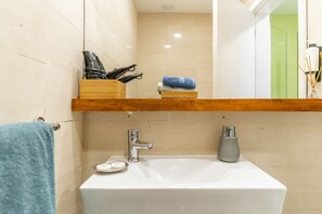 Shower, hair dryer, soap, shampoo