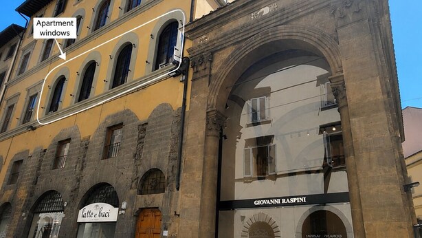A building with arched windows and a storefront for 'Giovanni Raspini Design.' - Timeless Elegance in the Heart of Florence  (Firenze)