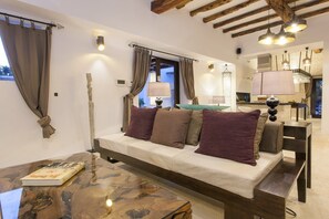 TV, fireplace - VILLA CAN RIBES - IBIZA LUXURY by Priority (Santa Eulalia del Río)