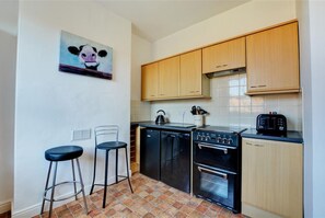 Fridge, microwave, oven, cookware/dishes/utensils