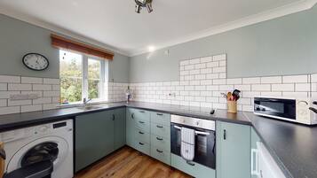 Fridge, microwave, oven, dining tables