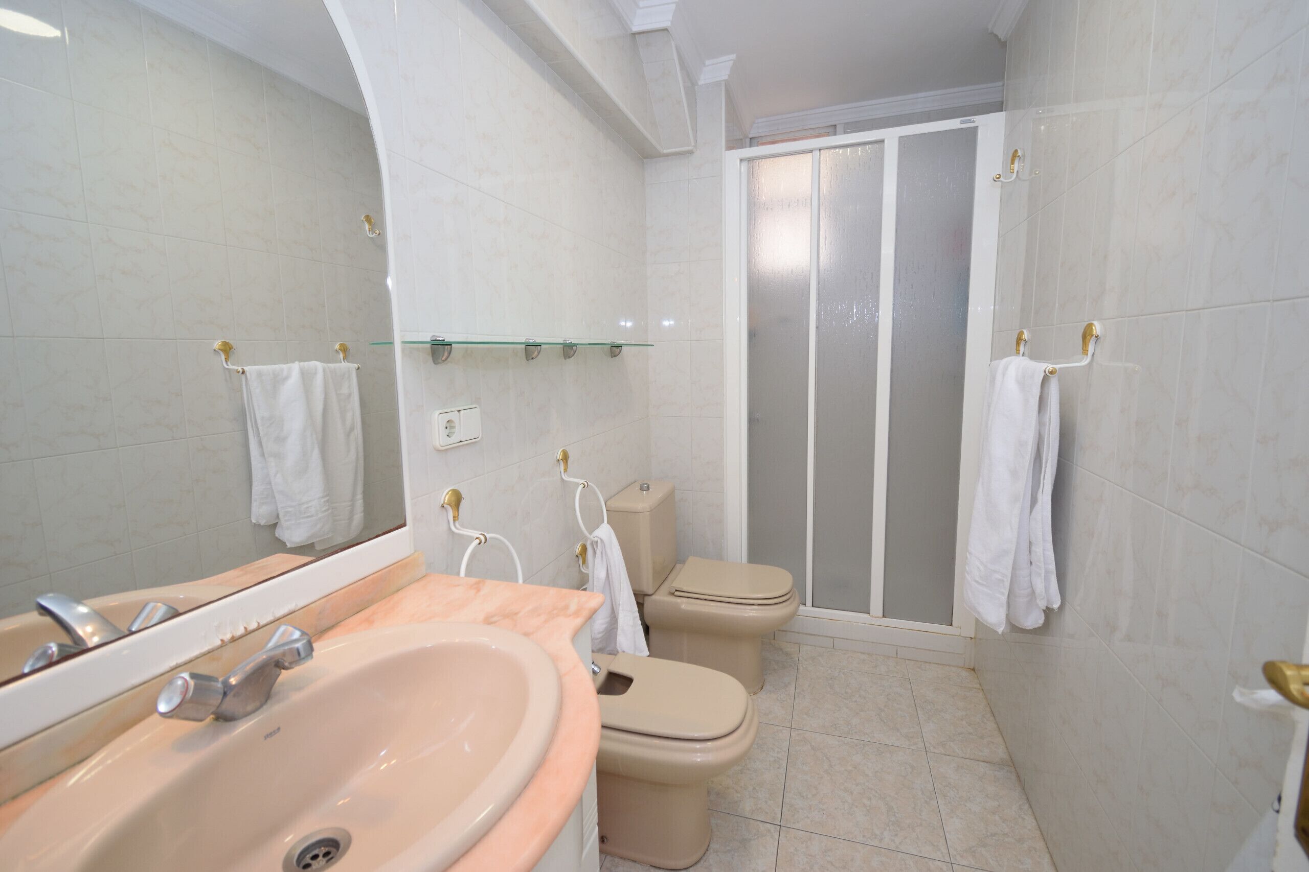 Bathtub, towels, toilet paper
