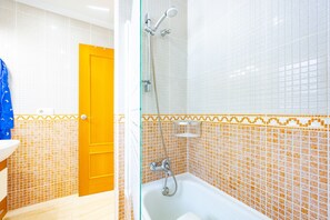 Bathtub, hair dryer, towels