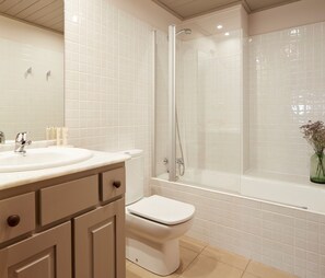 A bathroom with a white sink, toilet, and shower. - Val de Ruda Luxe 9 by FeelFree Rentals (Naut Aran)