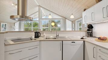 Fridge, stovetop, dishwasher, coffee/tea maker