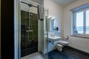 Shower, hair dryer, towels, soap