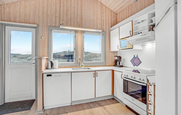 Fridge, stovetop, dishwasher, coffee/tea maker