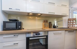 Fridge, stovetop, dishwasher, coffee/tea maker