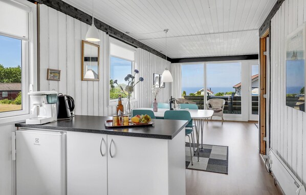Enjoy meals in the kitchen with a coffee maker and dining area.