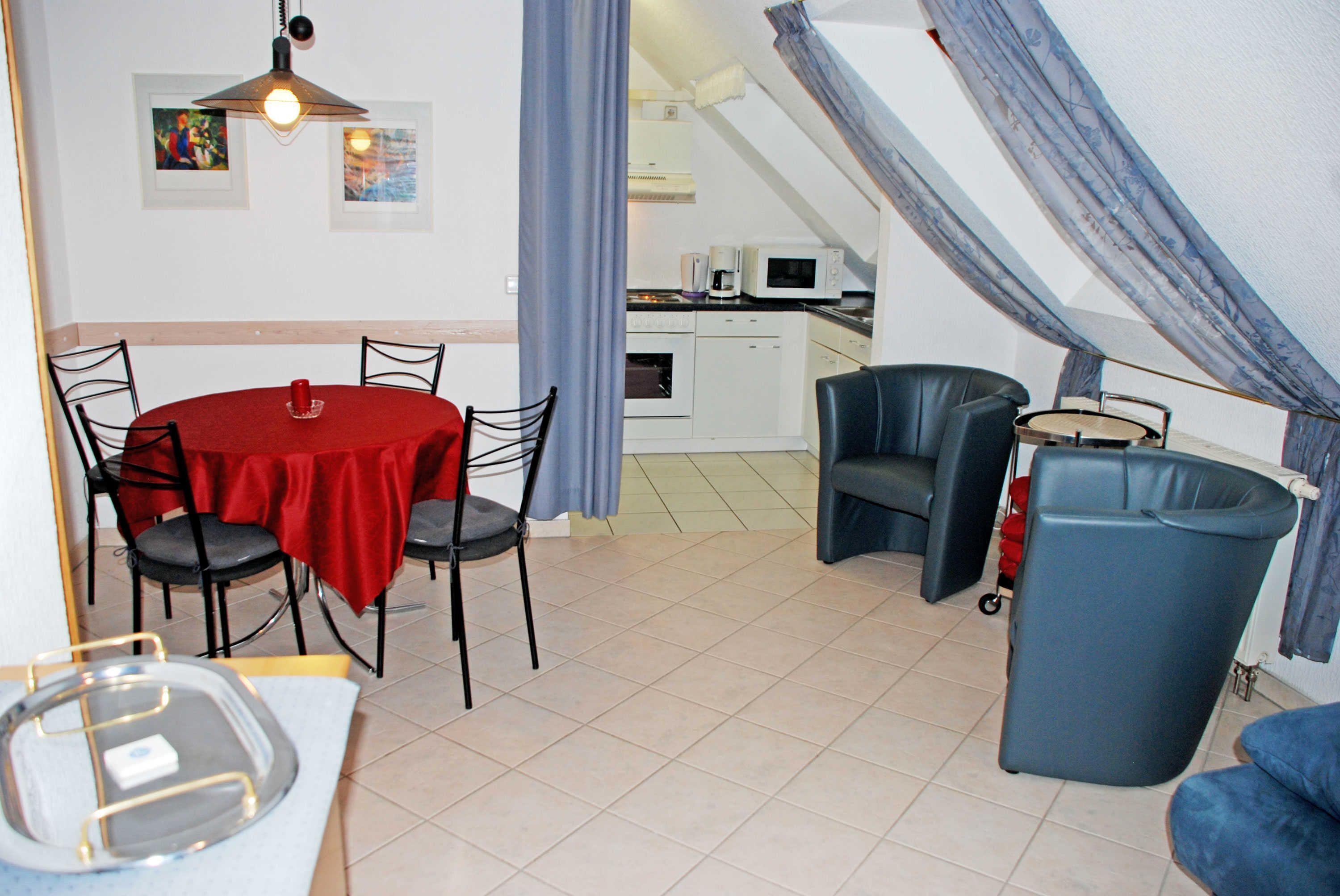 A compact kitchen with a microwave, oven, and dishwasher.