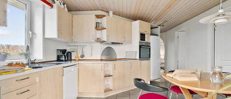 Fridge, stovetop, dishwasher, coffee/tea maker