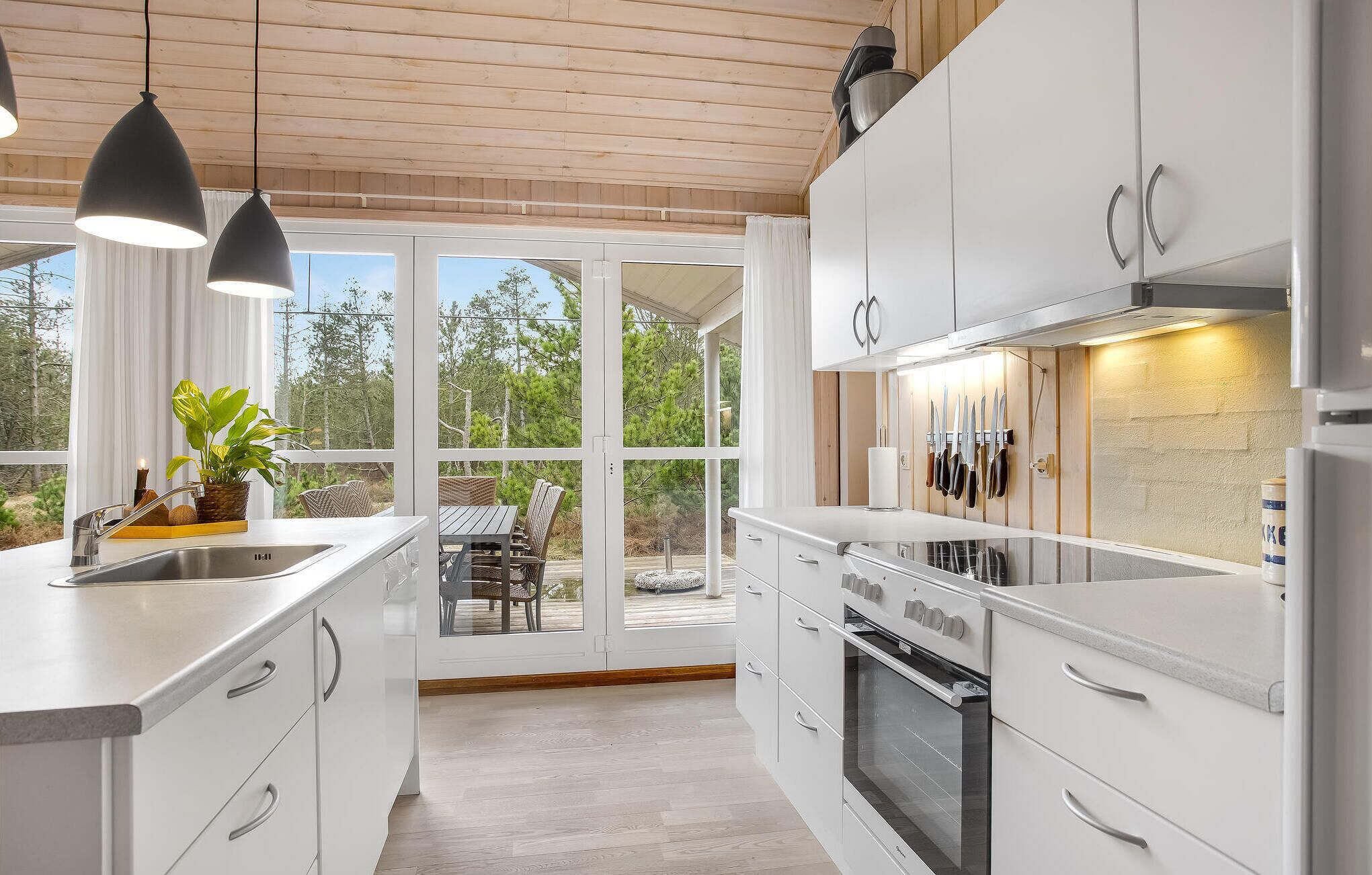 Fridge, stovetop, dishwasher, coffee/tea maker