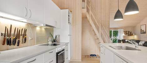 Fridge, stovetop, dishwasher, coffee/tea maker