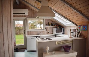 Fridge, stovetop, dishwasher, coffee/tea maker