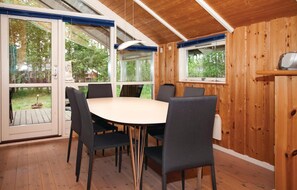 Enjoy meals in this cozy dining area with a round table and six chairs.