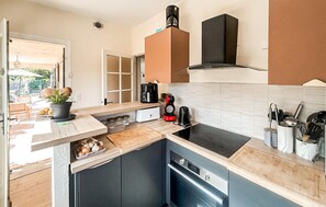 Fridge, stovetop, dishwasher, coffee/tea maker