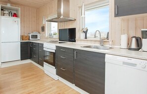 Fridge, stovetop, dishwasher, coffee/tea maker