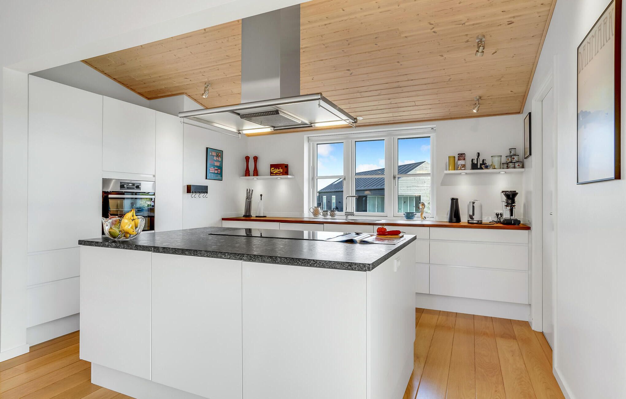 Fridge, stovetop, dishwasher, coffee/tea maker