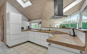 Fridge, stovetop, dishwasher, coffee/tea maker